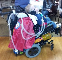 Liam's mom tricked-out his chair for a super hero birthday party!